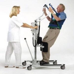 Female nurse helps elderly patient use Sit to Stand Patient Lift