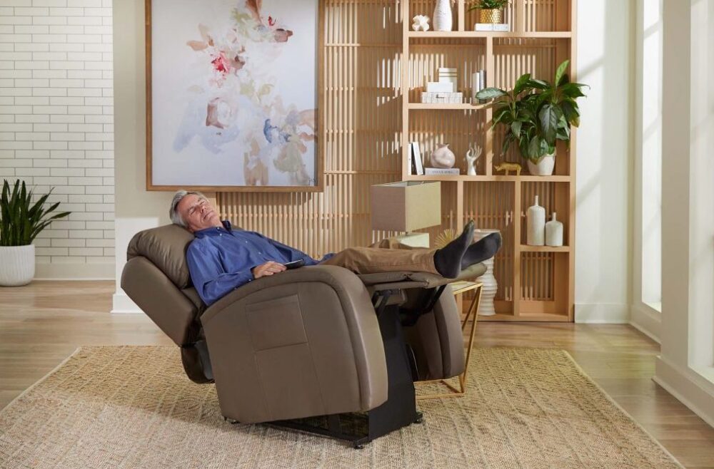 man sits in recliner lift chair in living room