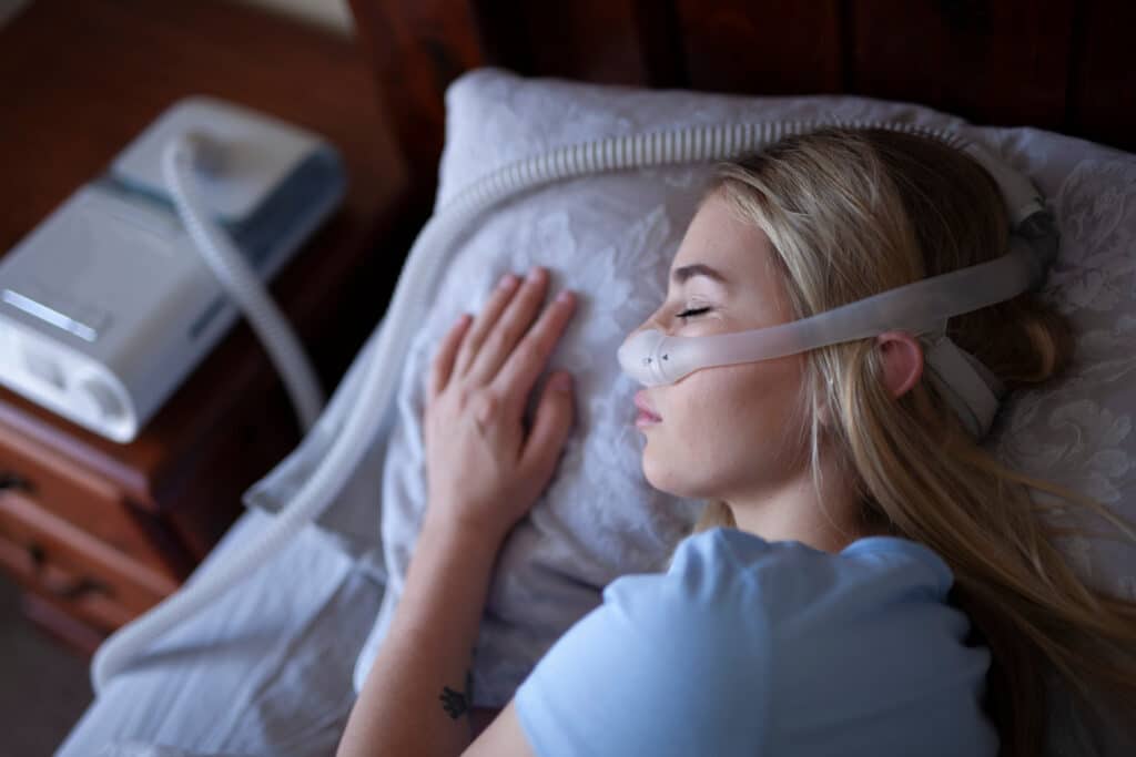 Woman sleeps with CPAP machine | Medical Supplies from You Can
