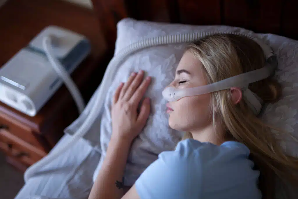 Woman sleeps with CPAP machine | Medical Supplies from You Can