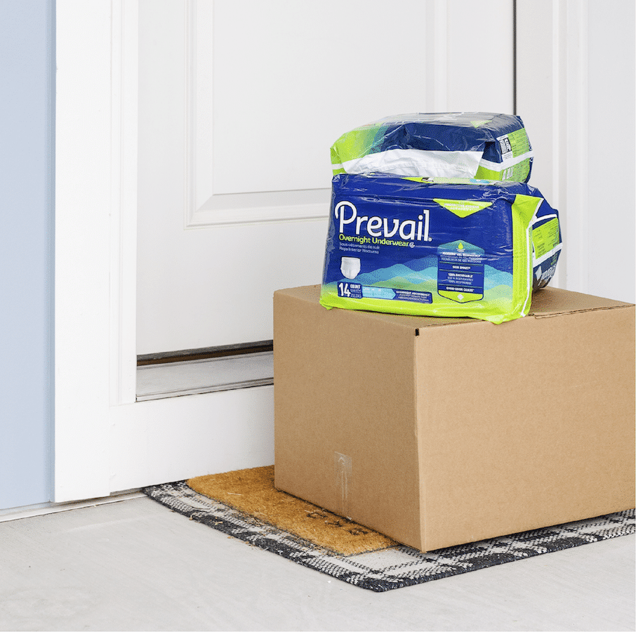Prevail incontinence supplies from Alpine Home Medical being delivered to a front door in a discreet cardboard box